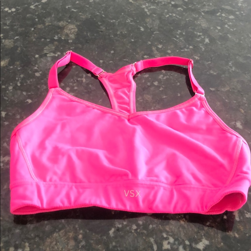 Bright pink Victoria’s Secret sports bra.